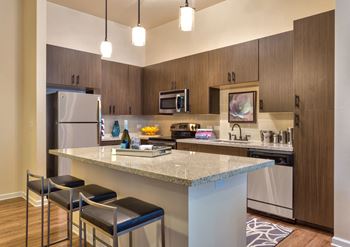 Fitted kitchen with island dining